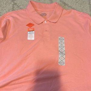 Peach colored polo.